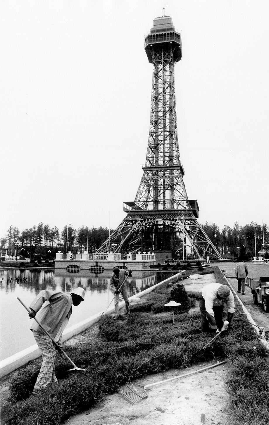 Landscape workers prepared gardens in front of the Eiffel Tower replica at Kings Dominion in Doswell, 1975.