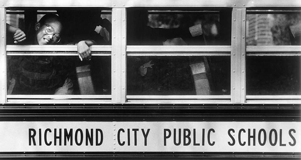 Corey Green peeked out the school bus window on his way home after the first day of school at John B. Cary Elementary School in Richmond, 1985