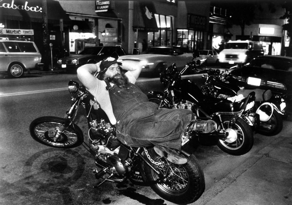 Tom Thomas kicked back on his Harley-Davidson outside Newgate Prison, a bar in the 900 block of West Grace Street in Richmond, 1985