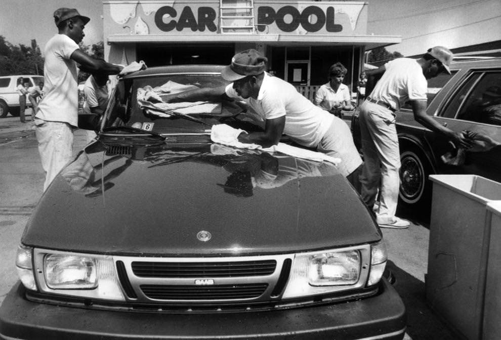 Employees at a Car Pool location in Richmond wiped off vehicles after the wash cycle, 1985