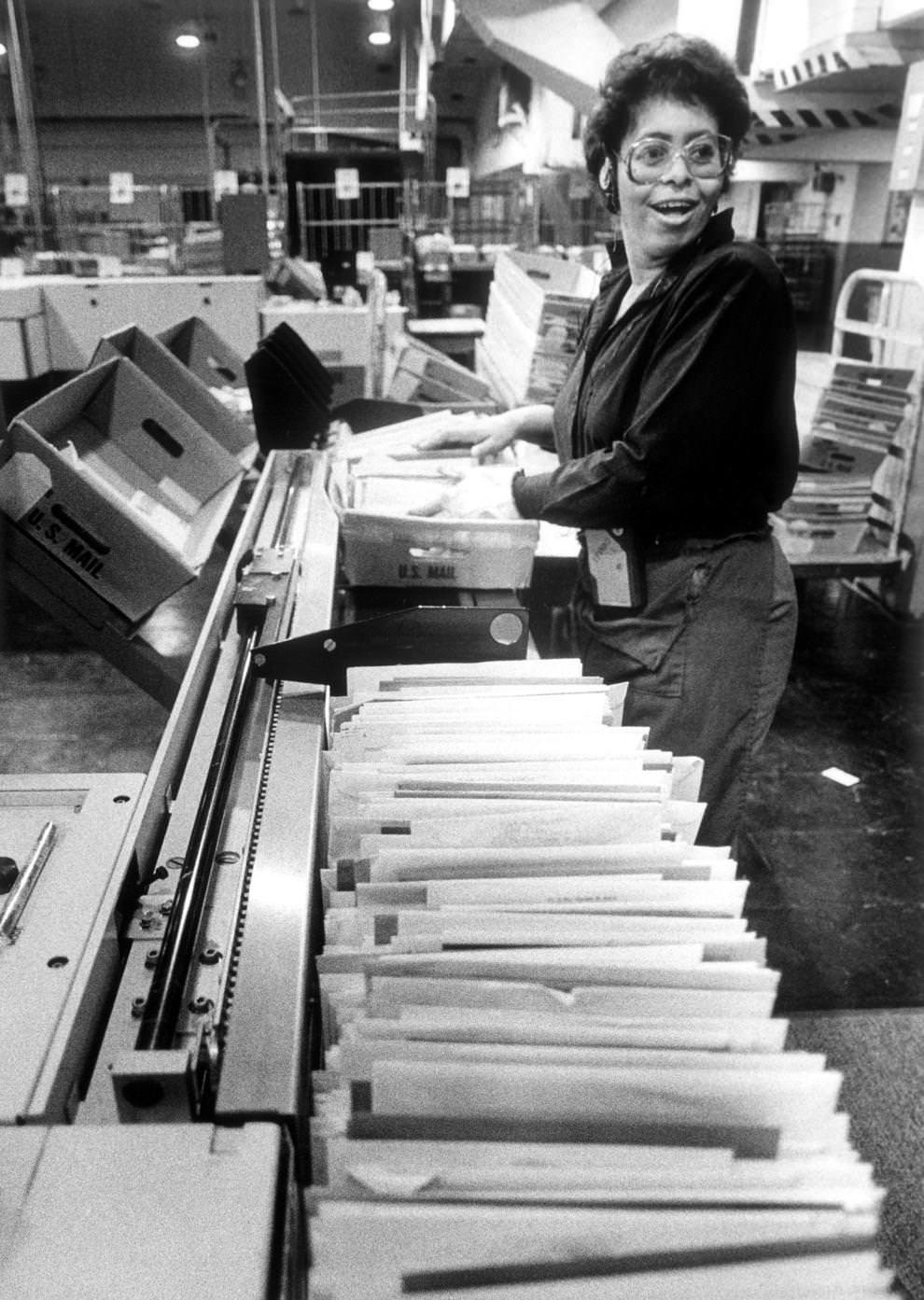 U.S. Postal Service employee Victoria Booker operated an optical character reader device in a Richmond branch to electronically read addresses on letters, 1986