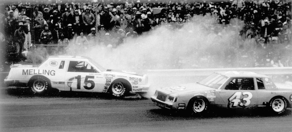 Benny Parsons spun his No. 15 car into the rail as Richard Petty went by in the Richmond 400 NASCAR race at the State Fairgrounds, February 1981