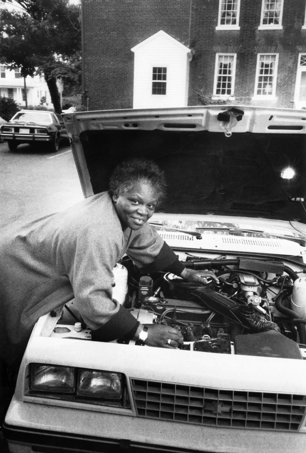 Hilda West worked on a car in Fredericksburg, where she had addressed an apprenticeship conference, 1986