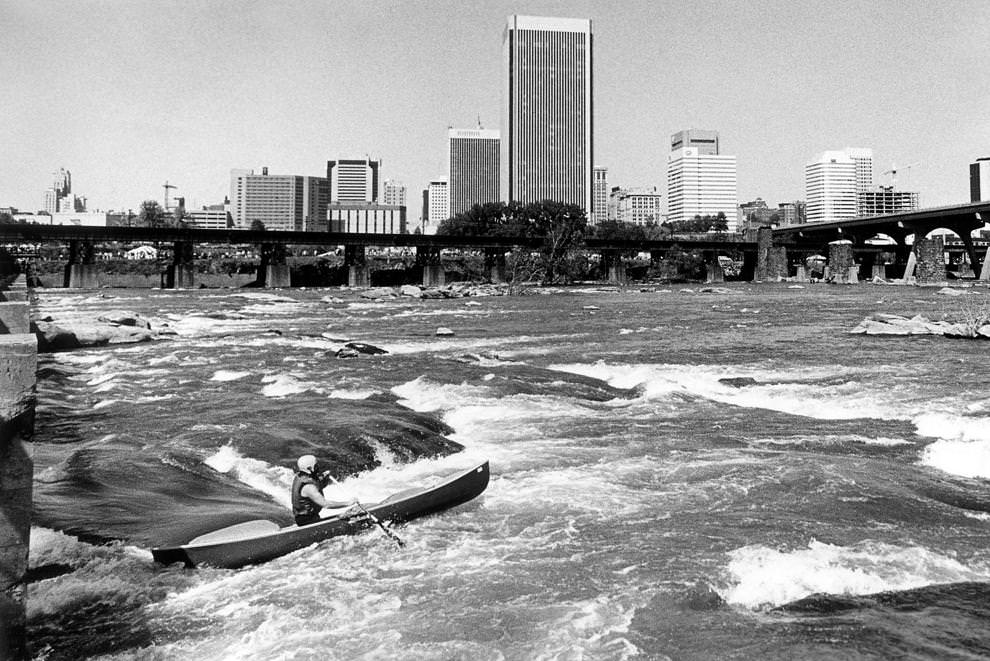 A canoeist navigated through the James River rapids near downtown Richmond during the Wild Water Race, which was part of Big River Weekend, 1987