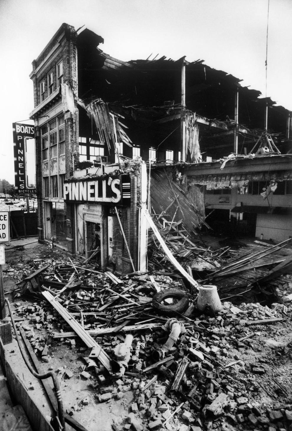 A section of the former Pinnell’s boat and bicycle shop on lay in ruins after demolition the day before, 1982