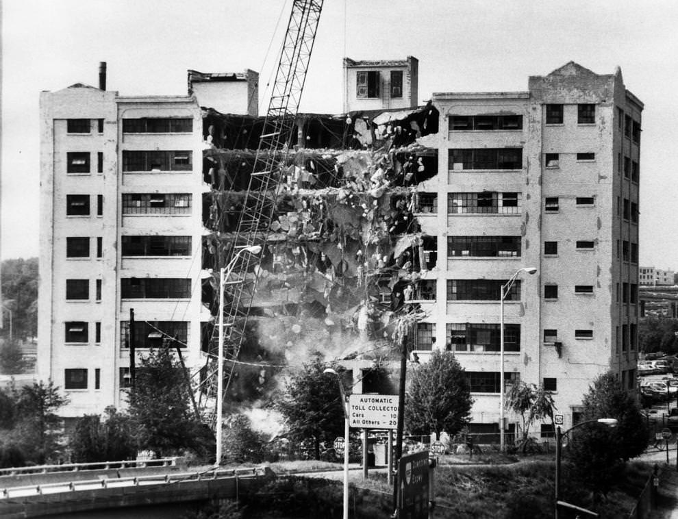 James Center Development Co. demolished this vacant building between East Canal Street and the Downtown Expressway to make way for the development of the James Center, 1985