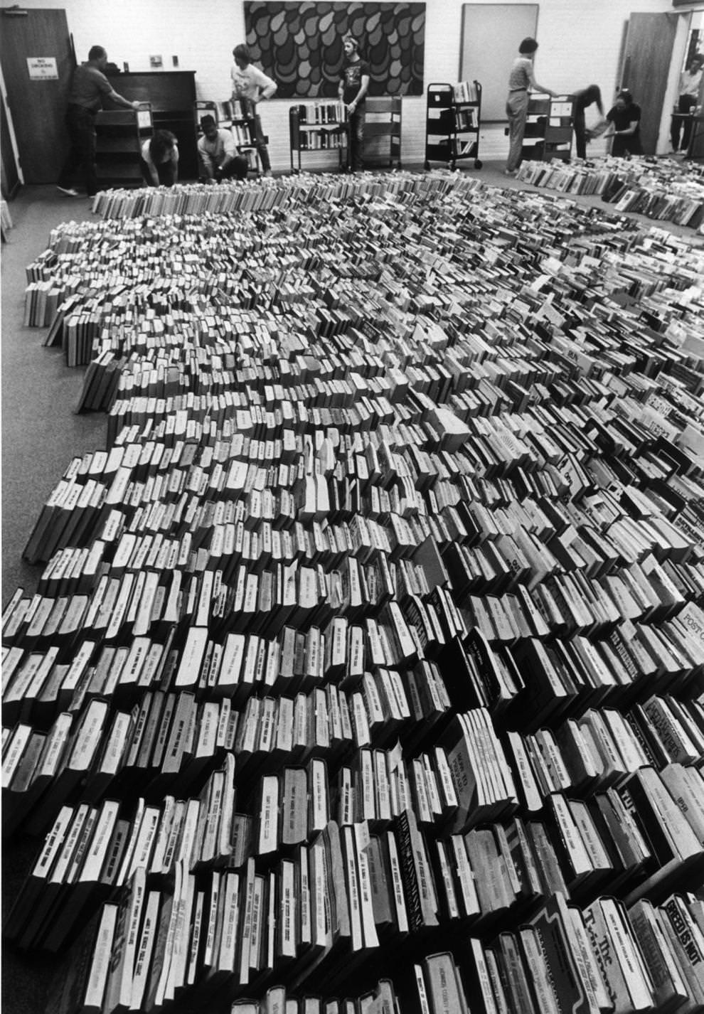 In preparation for new carpeting, the Dumbarton branch library in Henrico County had to remove about 80,000 books from shelves, 1987.