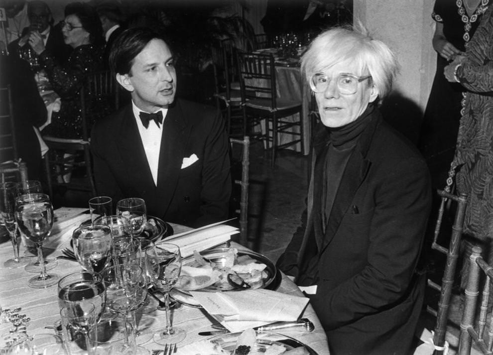 Pop artist Andy Warhol (right) dined with his business manager, Fred Hughes, in Richmond, 1985.