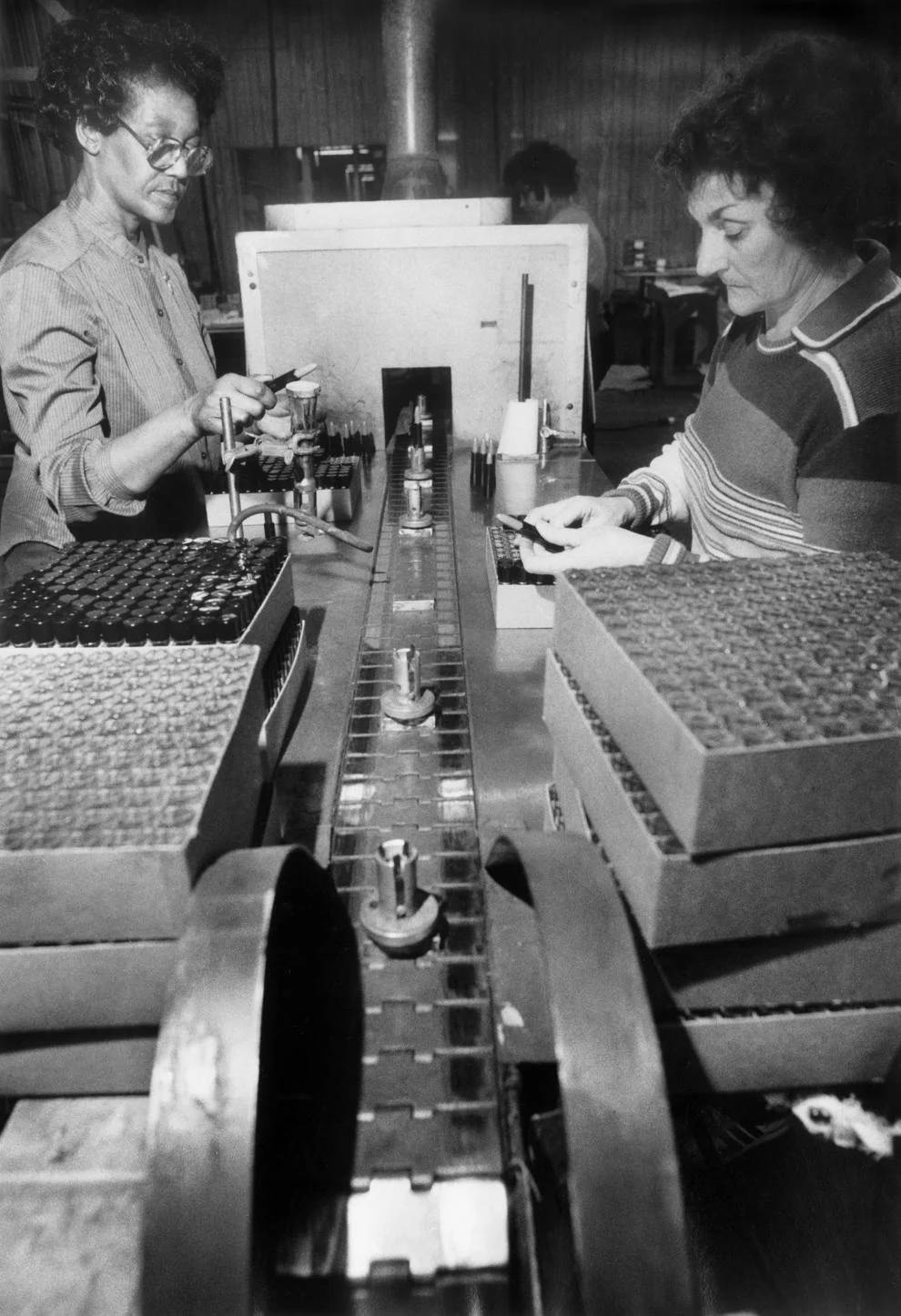 Mildred Ashton (left) and Elva Jones glazed lipstick on the assembly line at the A.R. Winarick cosmetics manufacturing plant in Westmoreland County, 1985.