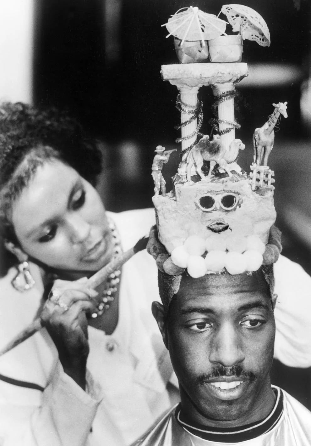 Kevin Cherry got an eye-catching look from Richmond hair stylist Shelira Morrison, who said the sculpture – columns, beasts, parasols and more – sprung to her imagination, 1991