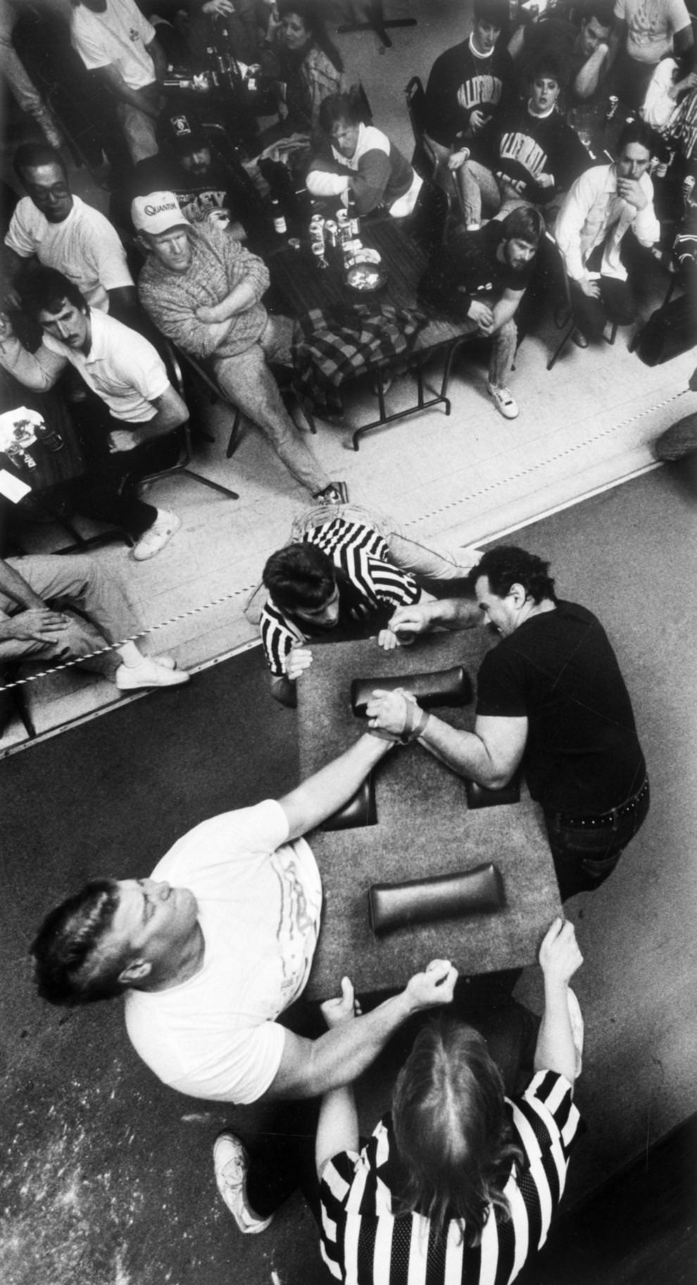 Tracy Ward (left) and John Ottarski squared off in the left-handed competition at the Virginia Classic Arm Wrestling Championship, held at Joe’s Place in Petersburg, 1991
