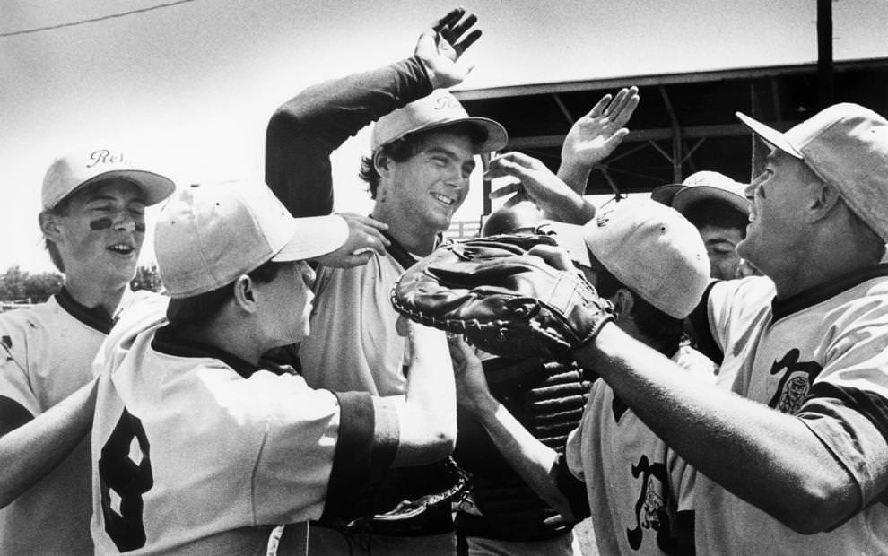 Pitcher Jay MacMillan of Douglas Freeman High School in Henrico County joined teammates in celebrating a 3-0 victory over Hampton High School in a Group AAA baseball playoff game, 1990