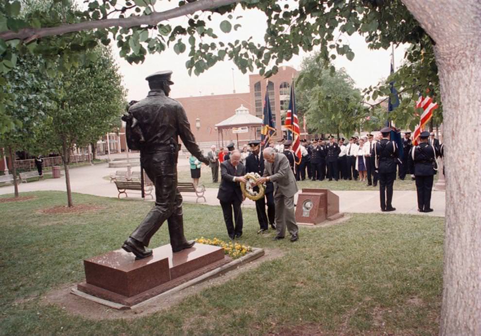 A wreath is placed at The Richmond Police Memorial Statue in Festival Park as part of a memorial service for police officers killed in the line of duty, 1996