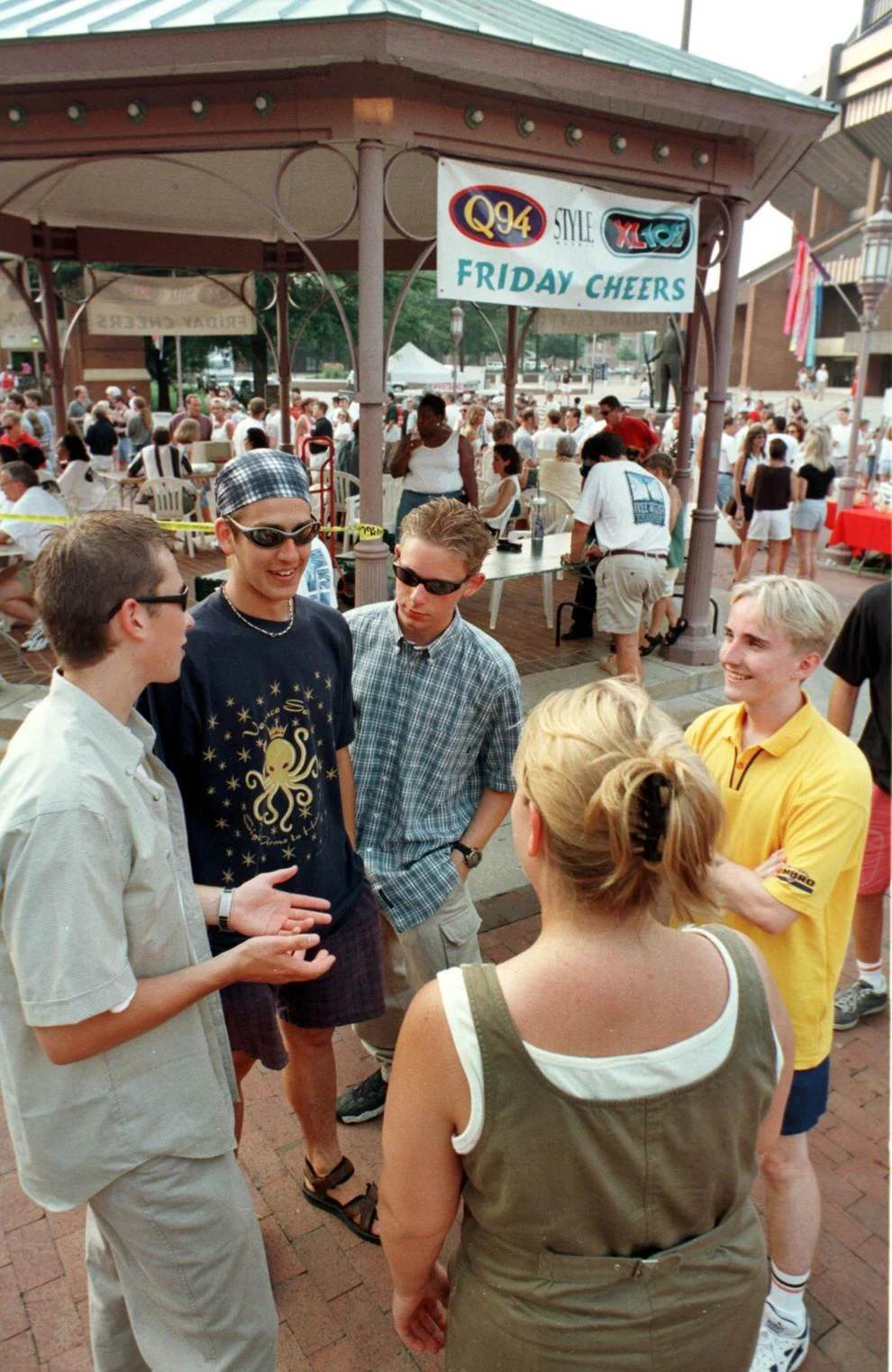 Curtis Littun,17; Mike Walkoski,18; Andrew Breborowicz, 17; Tomi Huttunen,17; talk to Cary Langhorne,21 (back to camera) at Friday Cheers. The 4 males are exchange students, 1998