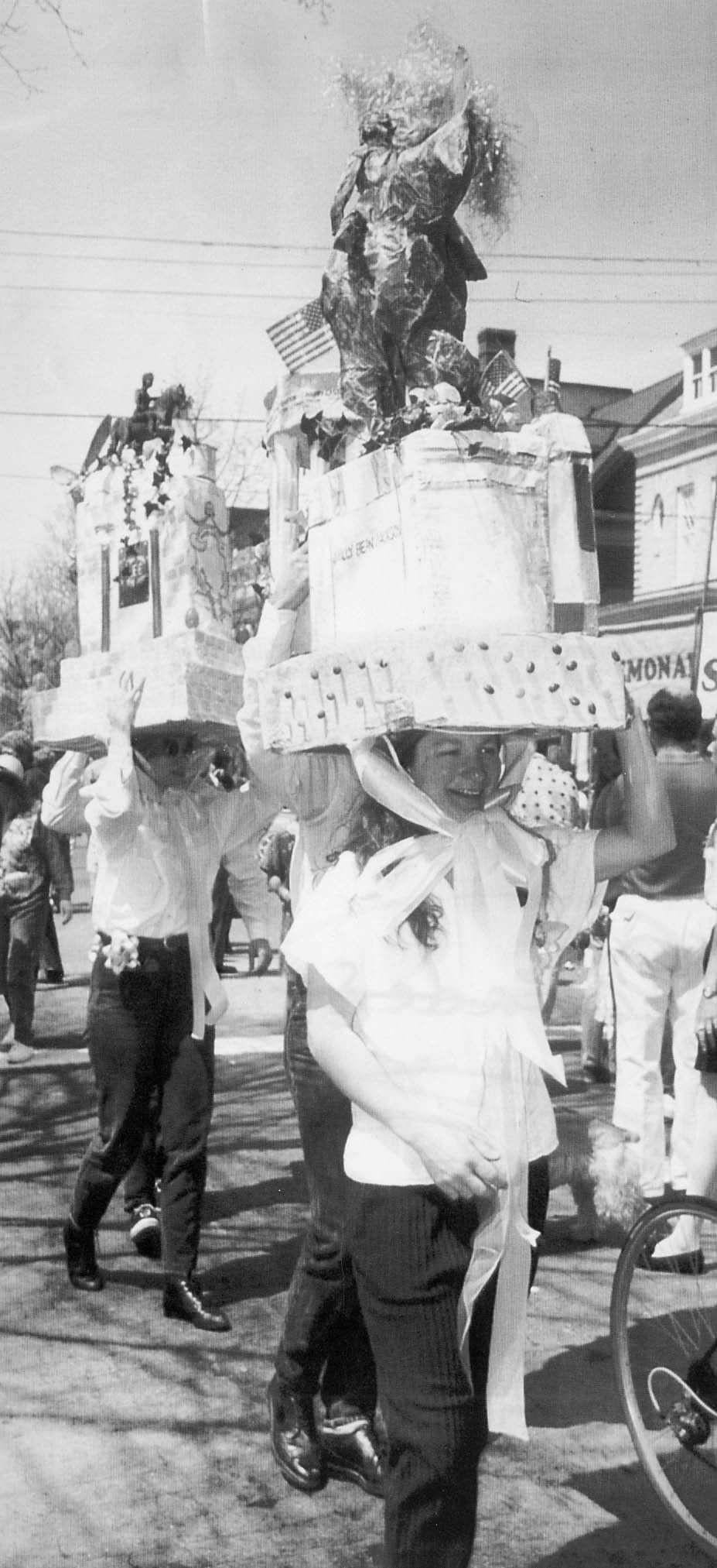 Front to back: Catherine Fleishman and her friends walk down Monument Ave. Catherine will have their bonnets in the Easter Bonnet competition, 1992.