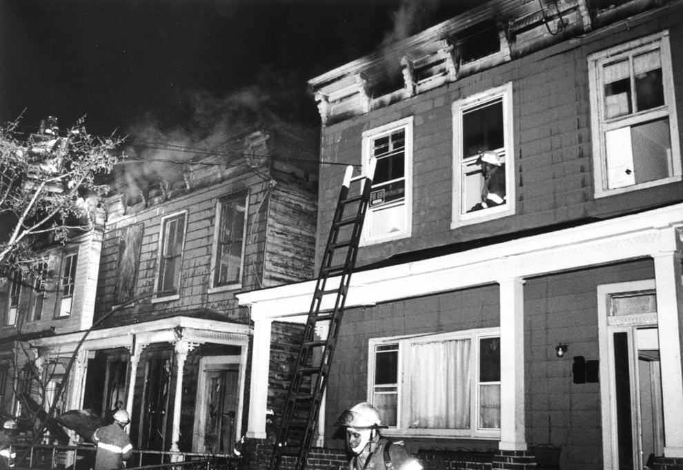 Wind-Blown sparks from the fire at 702 N. 24th St. (center) set the two adjoining house afire, 1992