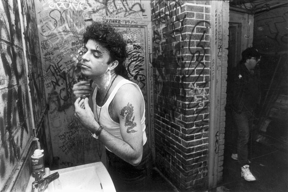 Cracker band member Johnny Hickman shaves before a show at the 9:30 Club in Washington, D.C. The band's van broke down so they had little time for hygiene before the performance, 1992