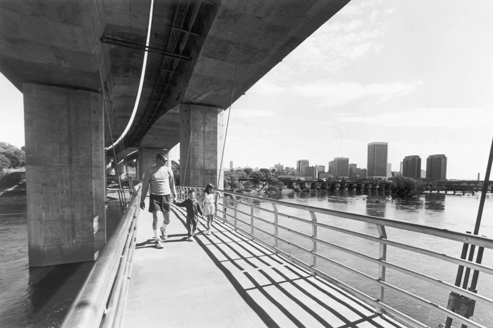 A pedestrian bridge leads from Tredegar Street to Belle Isle, a new section of the James River Park system, 1991