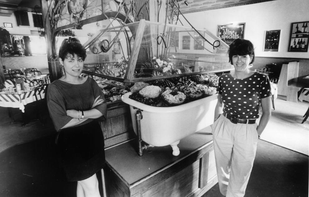 The Strawberry Street Cafe's salad bar is one of the best in town. Waitress Rhonda Ashby (left) and co-manager Julia Zenone flank the tub of treats. The cafe has an inviting atmosphere, a diverse menu and moderate prices.