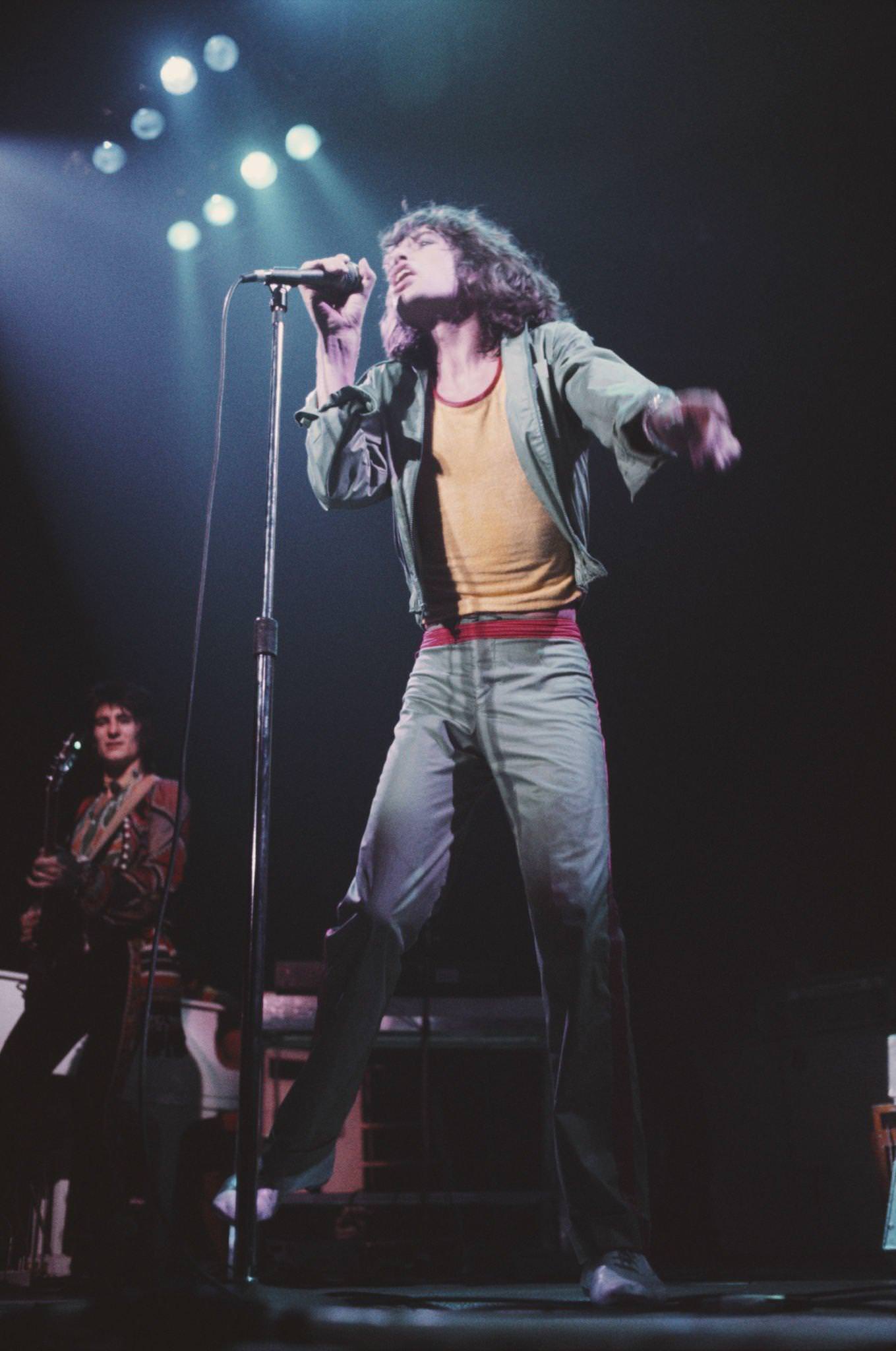 Ronnie Wood and Mick Jagger perform on stage during the tour, June 1975.