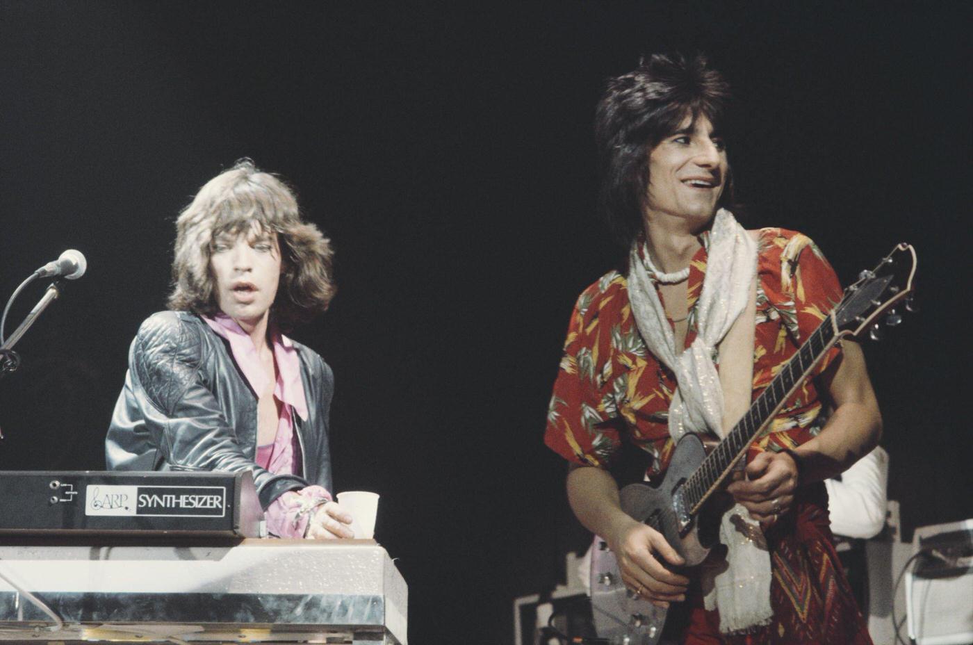 Mick Jagger and Ronnie Wood perform on stage during the tour, June 1975.