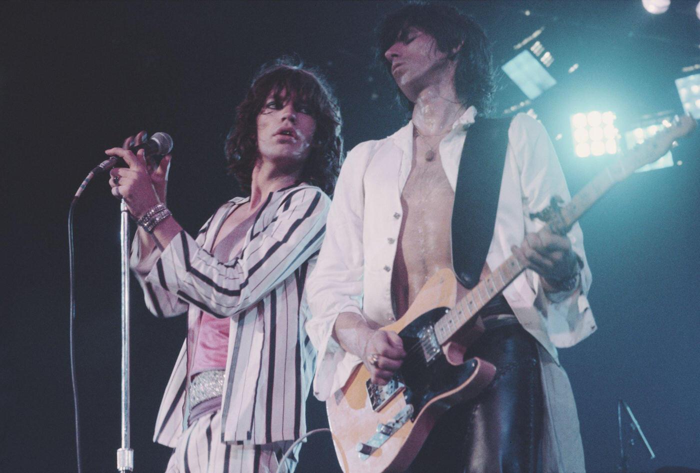 Mick Jagger and Keith Richards perform on stage during the tour, June 1975.