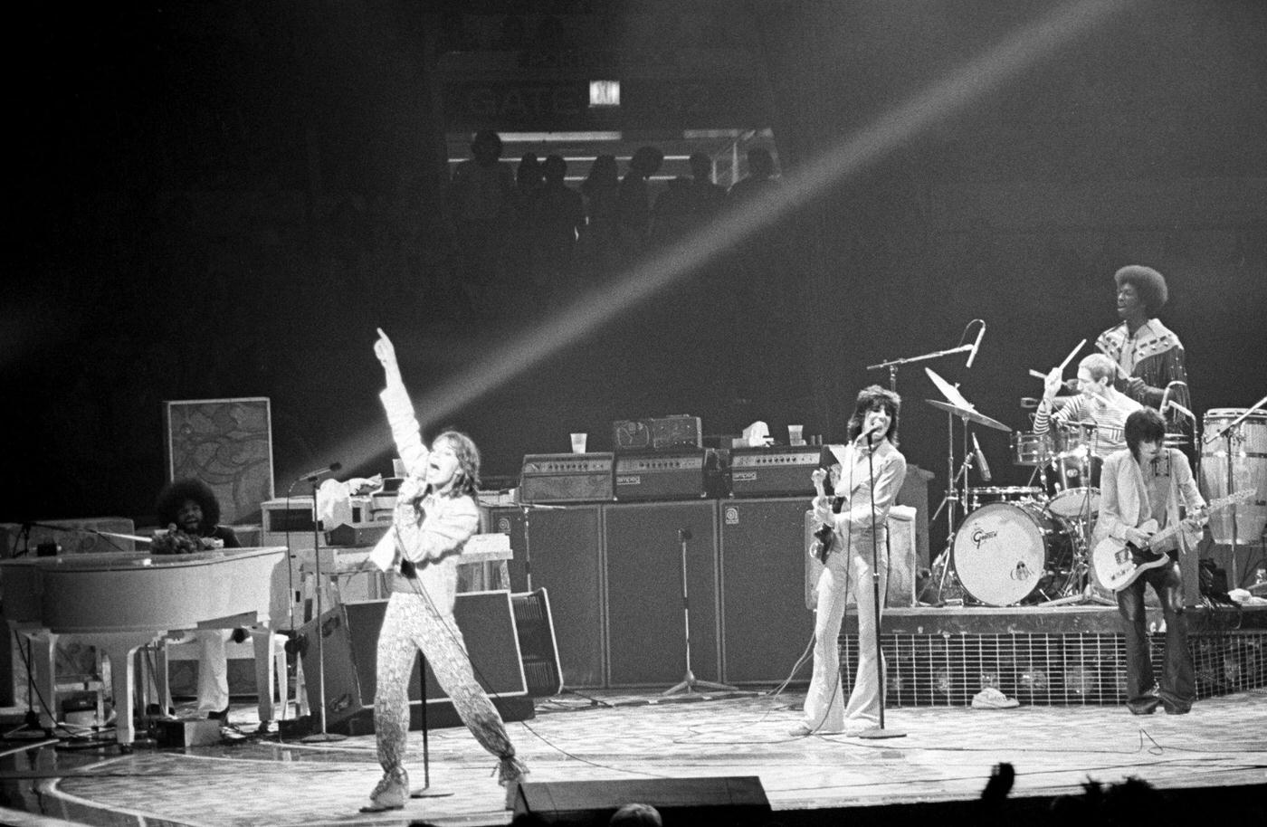 Billy Preston, Mick Jagger, Ronnie Wood, Charlie Watts, and Keith Richards perform on stage at Madison Square Garden during the band's "Tour of America '75" on July 23, 1975, in New York, New York.