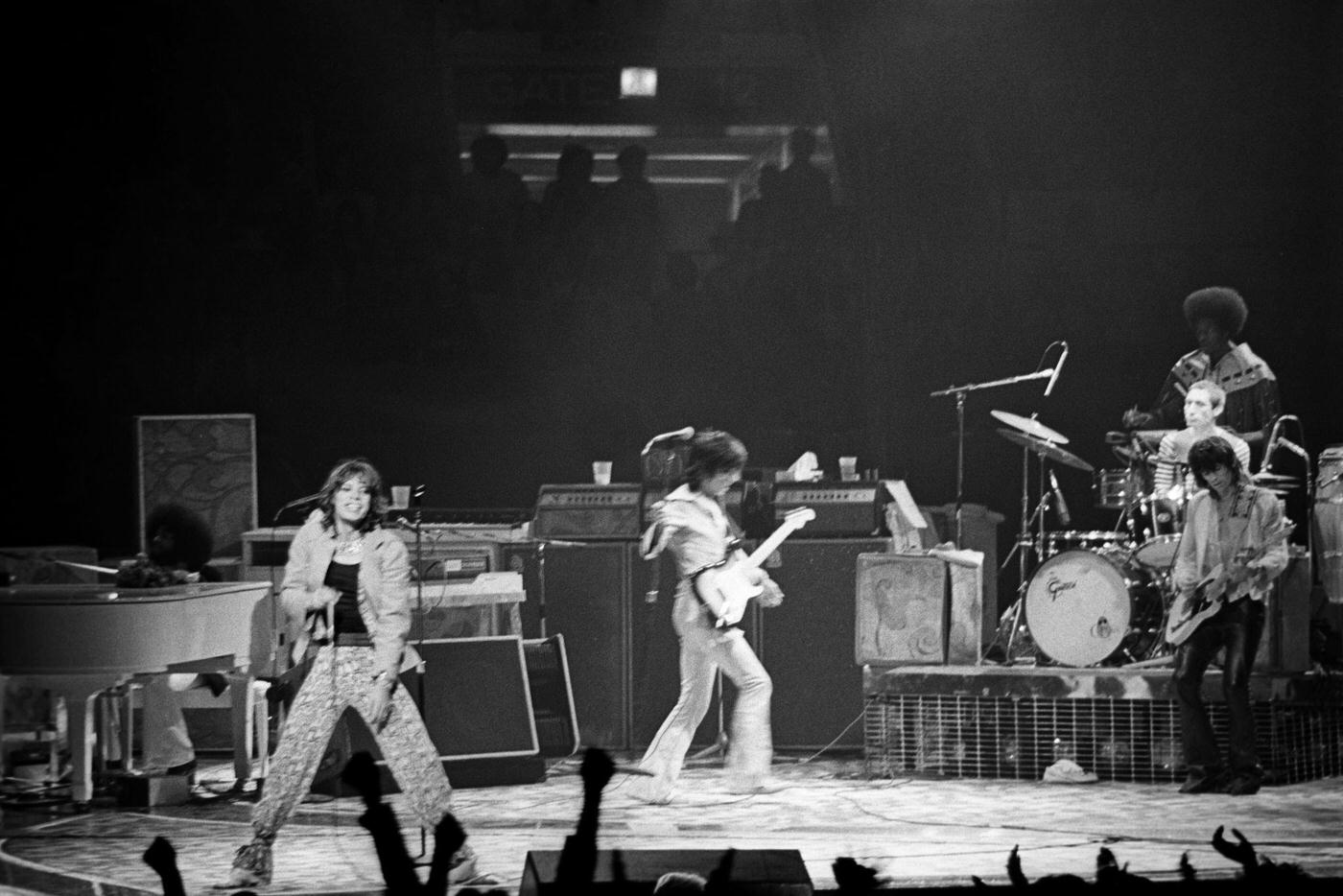 The Rolling Stones perform at Madison Square Garden with Mick Jagger, Ronnie Wood, Keith Richards, Charlie Watts, Billy Preston, and Ollie Brown on June 25, 1975, in New York, New York.