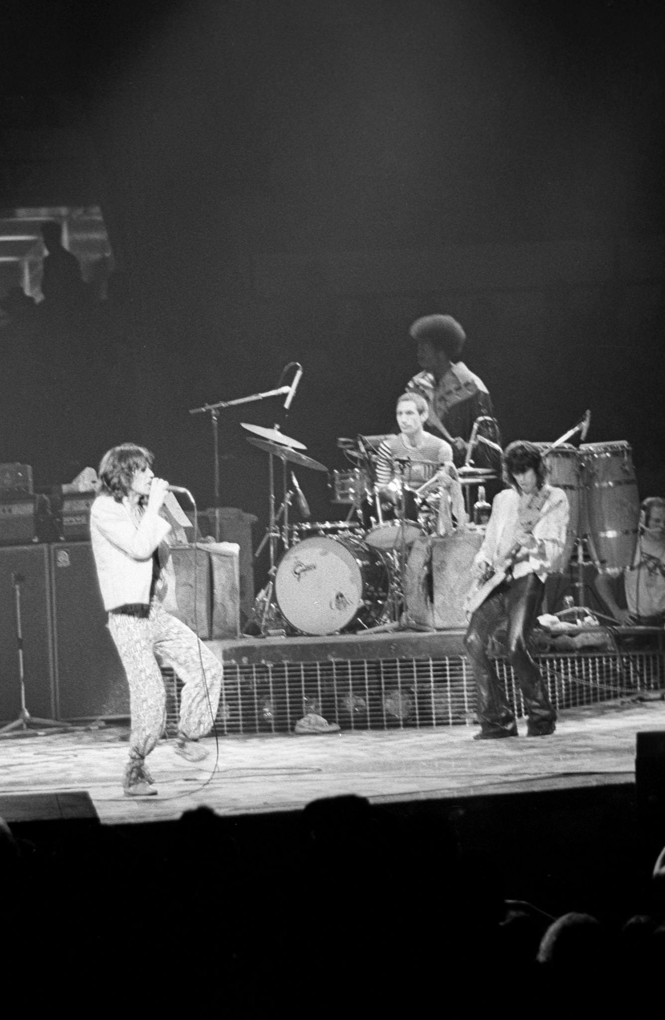 Mick Jagger, Keith Richards, and Charlie Watts perform with percussionist Ollie Brown at Madison Square Garden during the band's "Tour of America '75" on June 25, 1975, in New York, New York.