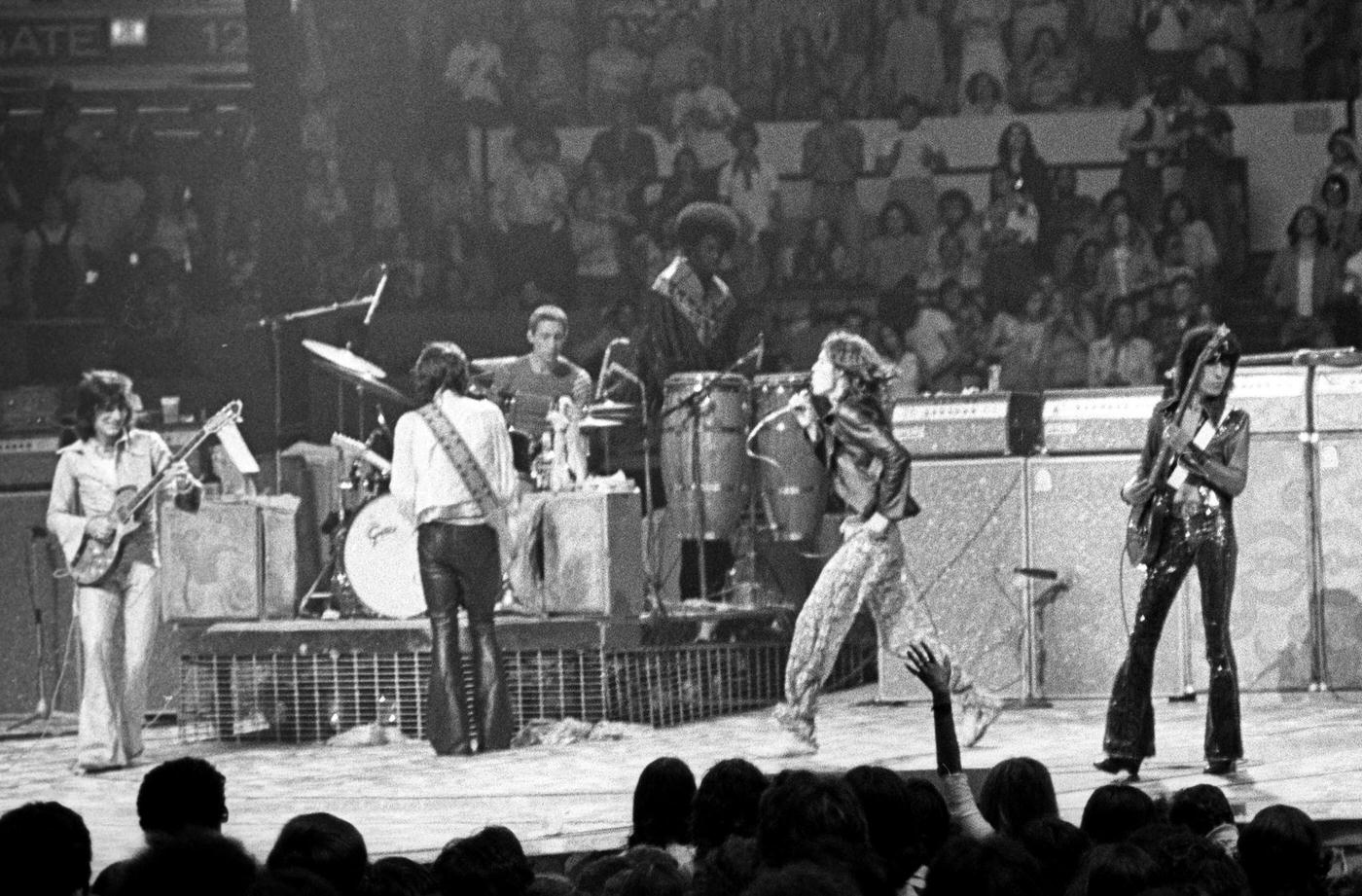 Ronnie Wood, Keith Richards, Charlie Watts, Mick Jagger, and Bill Wyman perform with percussionist Ollie Brown at Madison Square Garden during the band's "Tour of America '75" on June 25, 1975, in New York, New York.