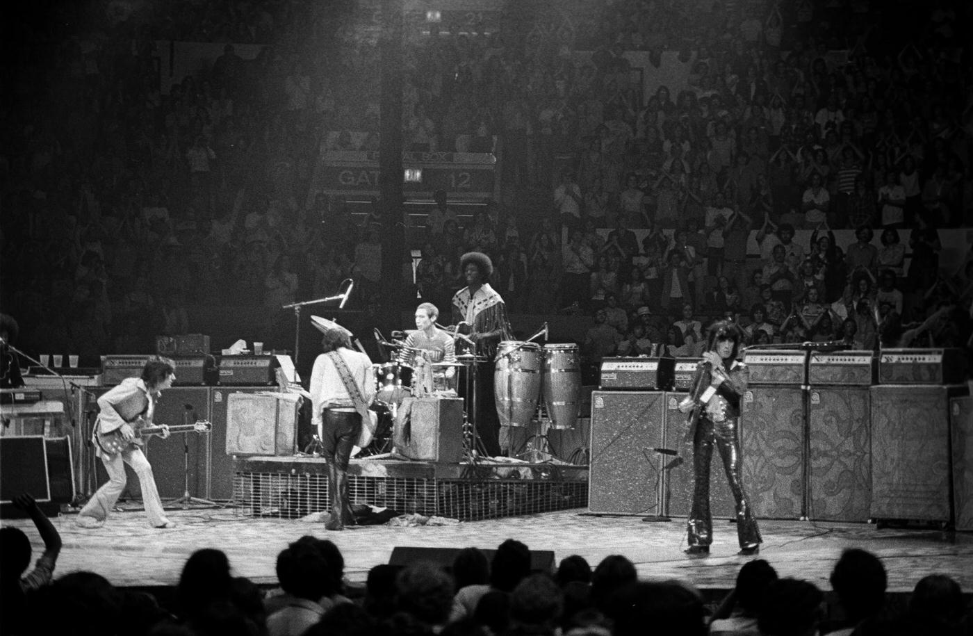 Ronnie Wood, Keith Richards, Charlie Watts, Bill Wyman, Mick Jagger, Ollie Brown, and Billy Preston perform at Madison Square Garden during the band's "Tour of America '75" on June 25, 1975, in New York, New York.