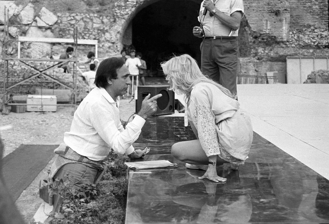Pippo Baudo and Heather Parisi rehearsing for the Nastri d'Argento ceremony at the Ancient Theatre of Taormina, 1984.