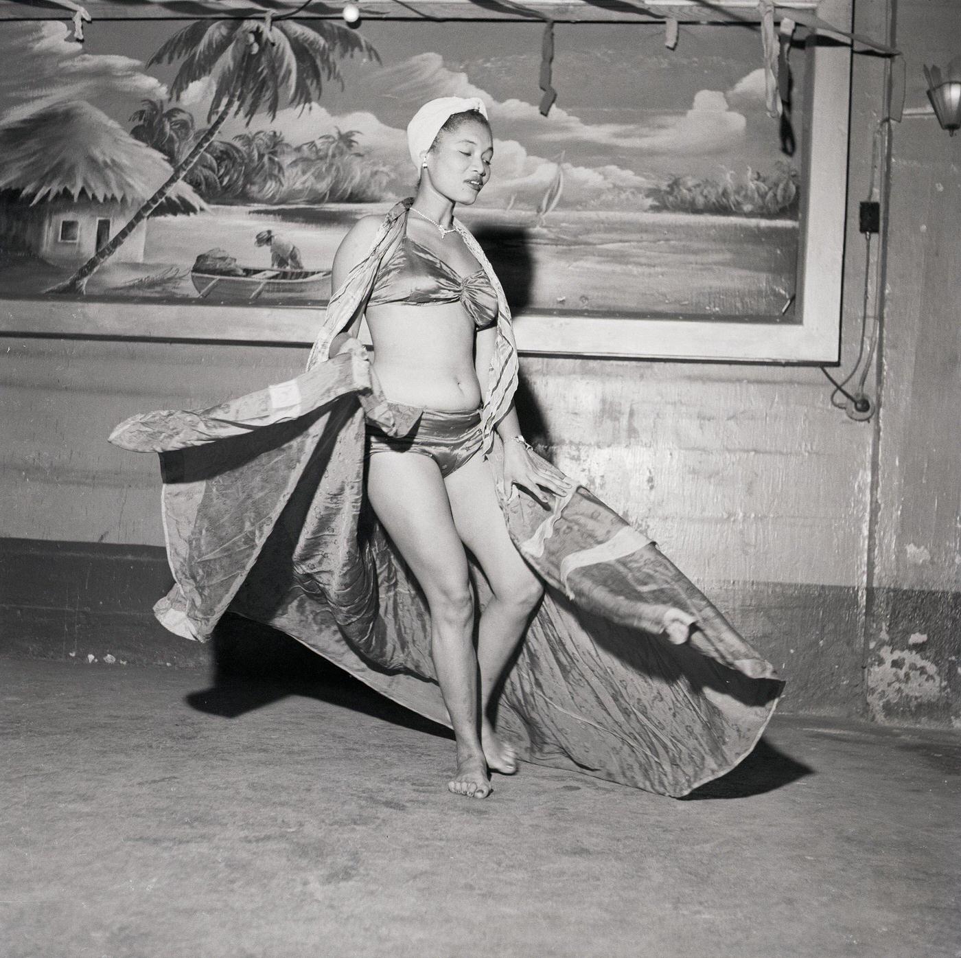 Woman performing in bikini and scarves, Trinidad