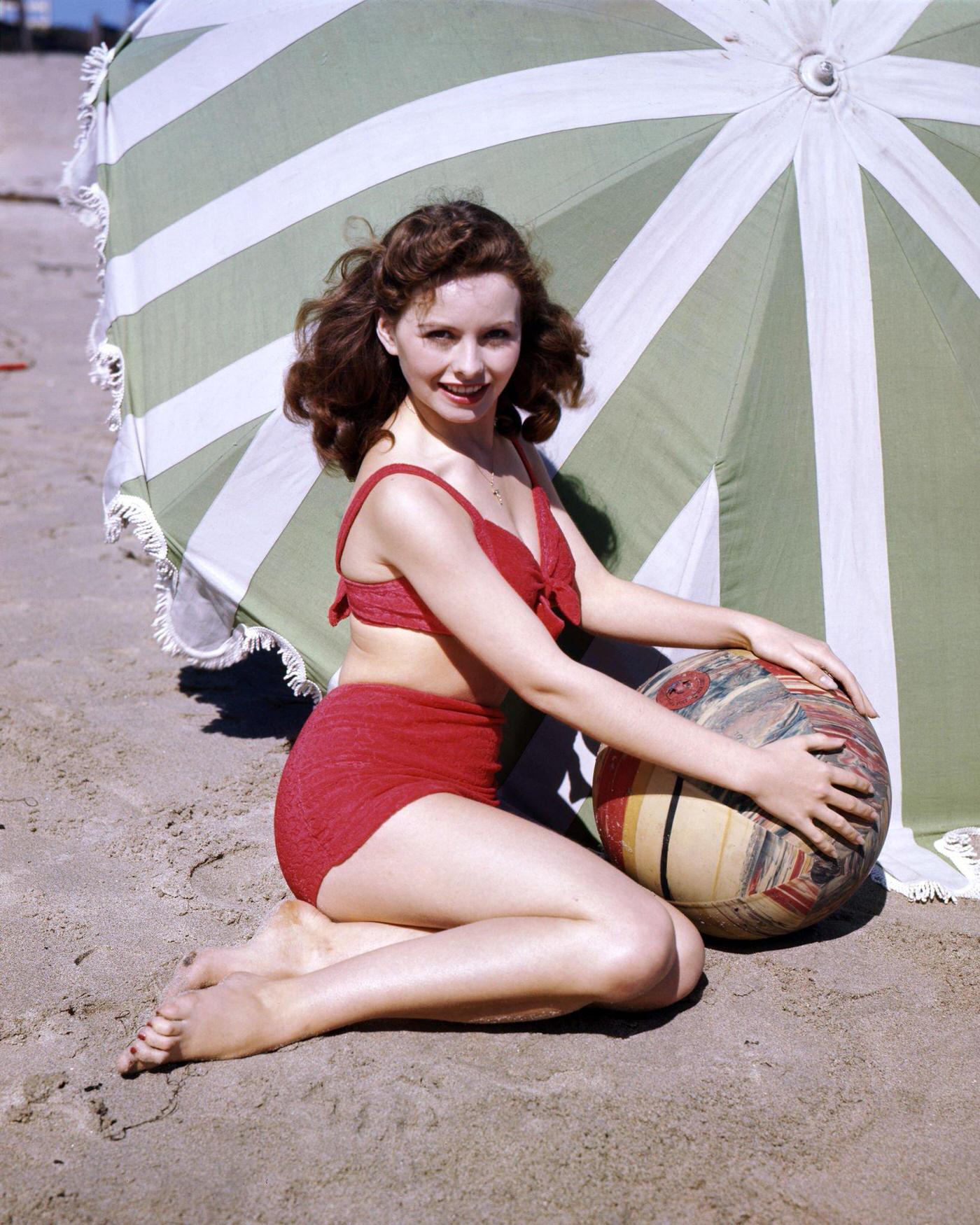 Jeanne Crain at the beach wearing a bikini, 1945.