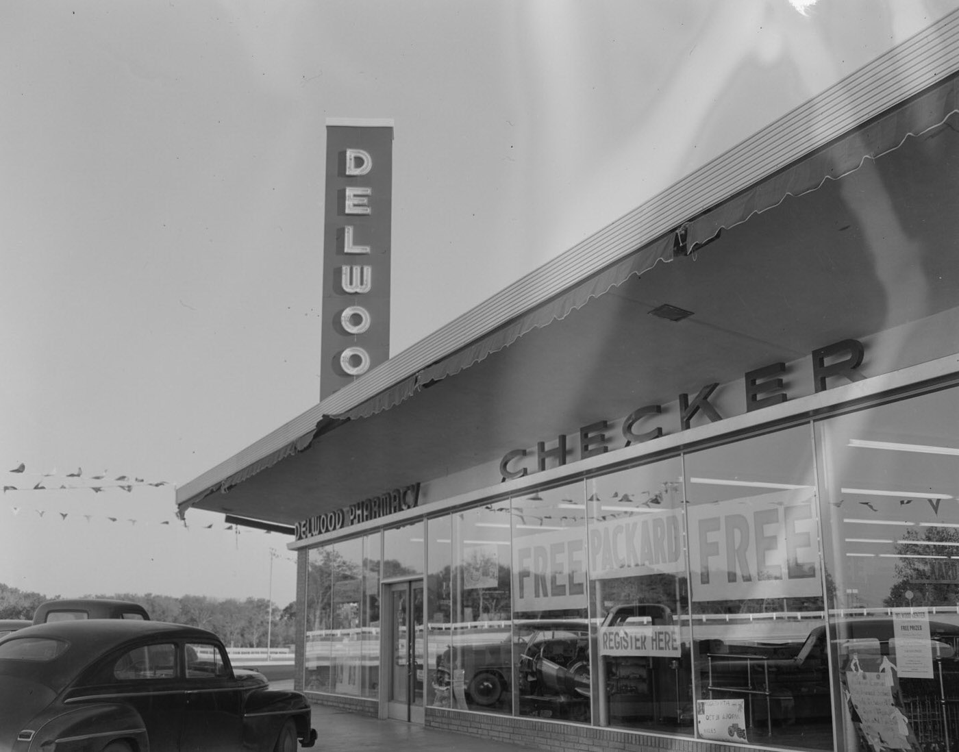 Delwood Pharmacy Building with Parked Cars, 1953