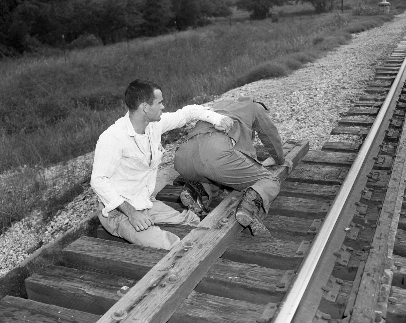 Man Repairing Main Railroad Trestle, 1958.