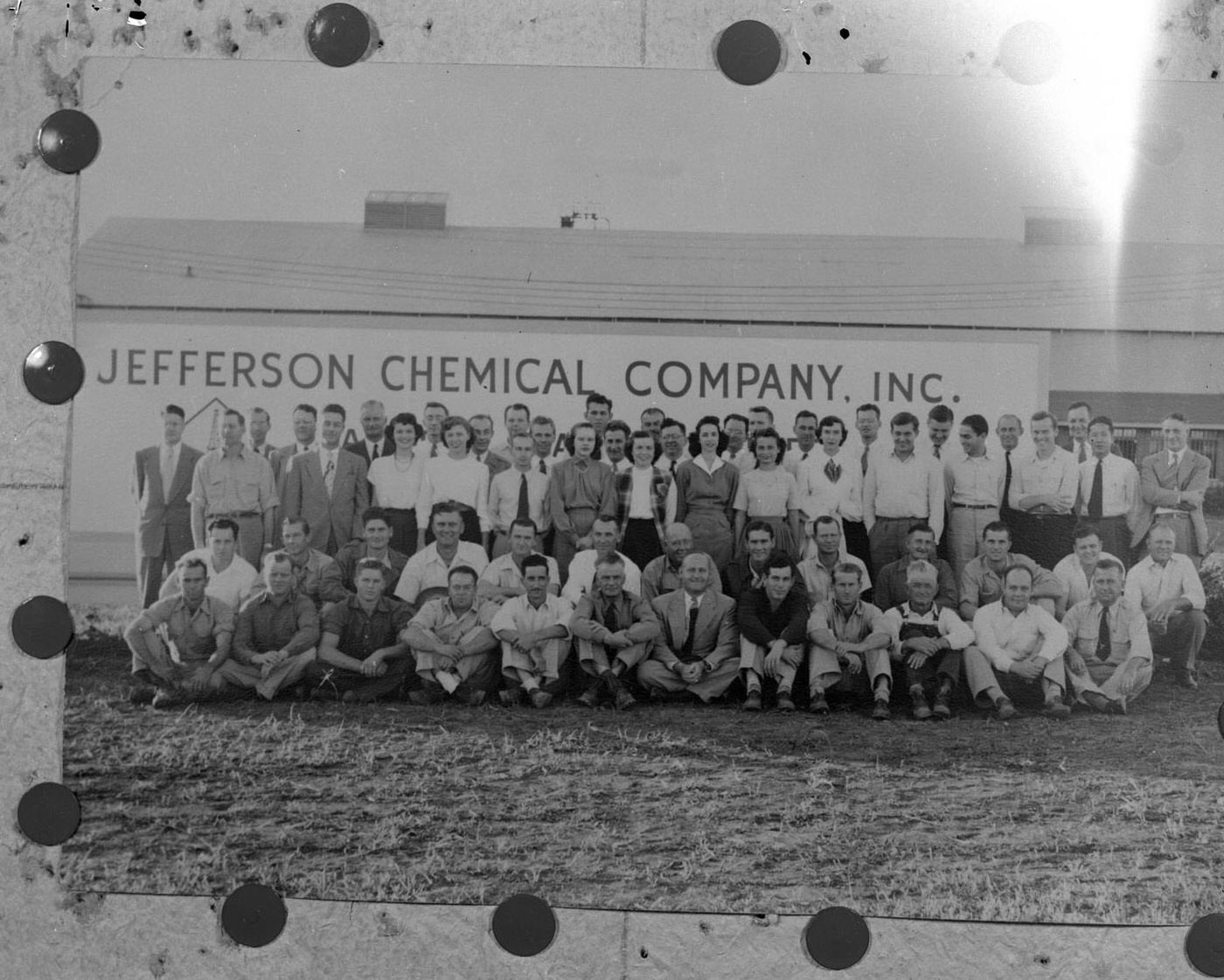 Jefferson Chemical Company Employees in Front of Sign, 1950.