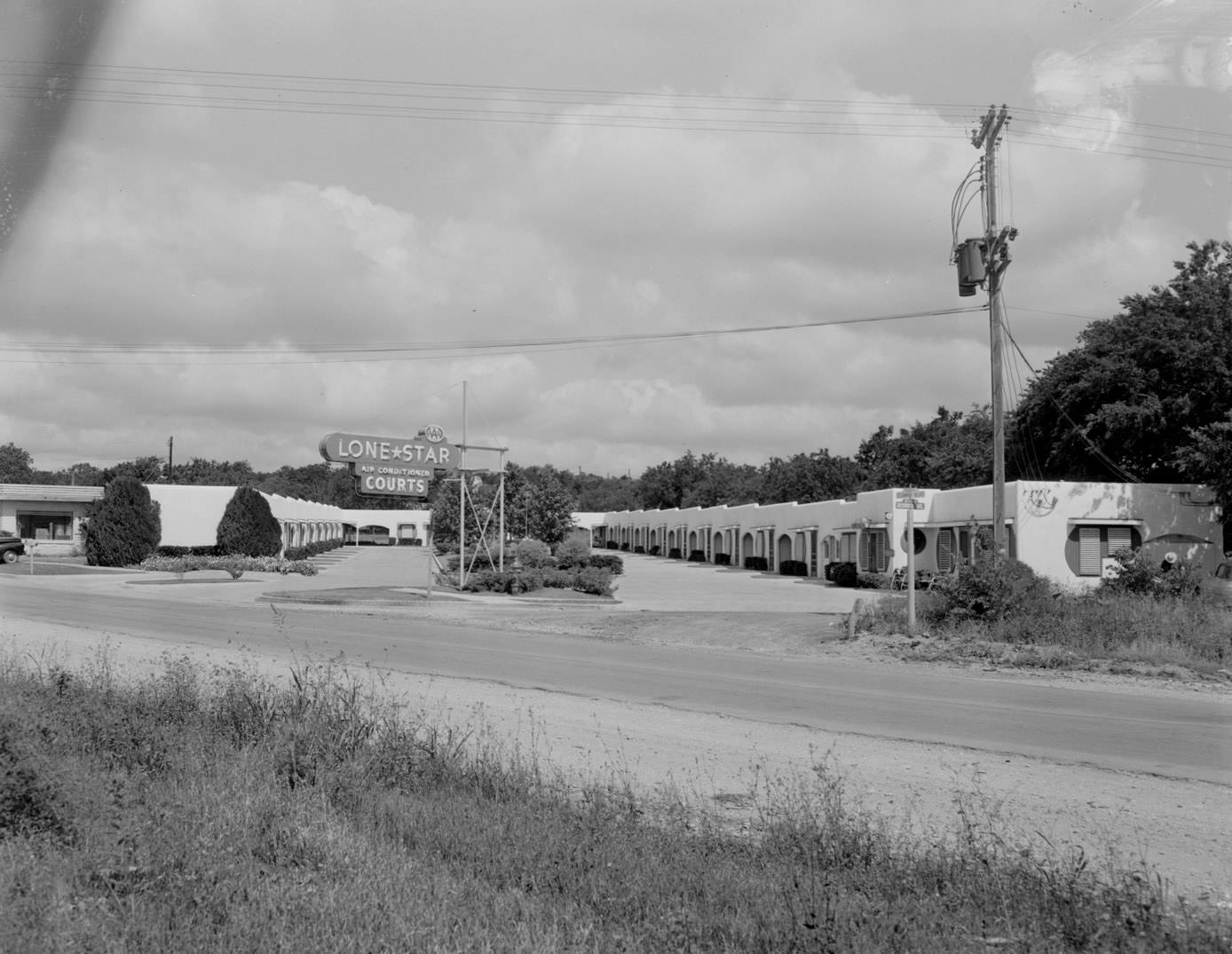Exterior of Lone Star Courts Motel with Sign, 1954.