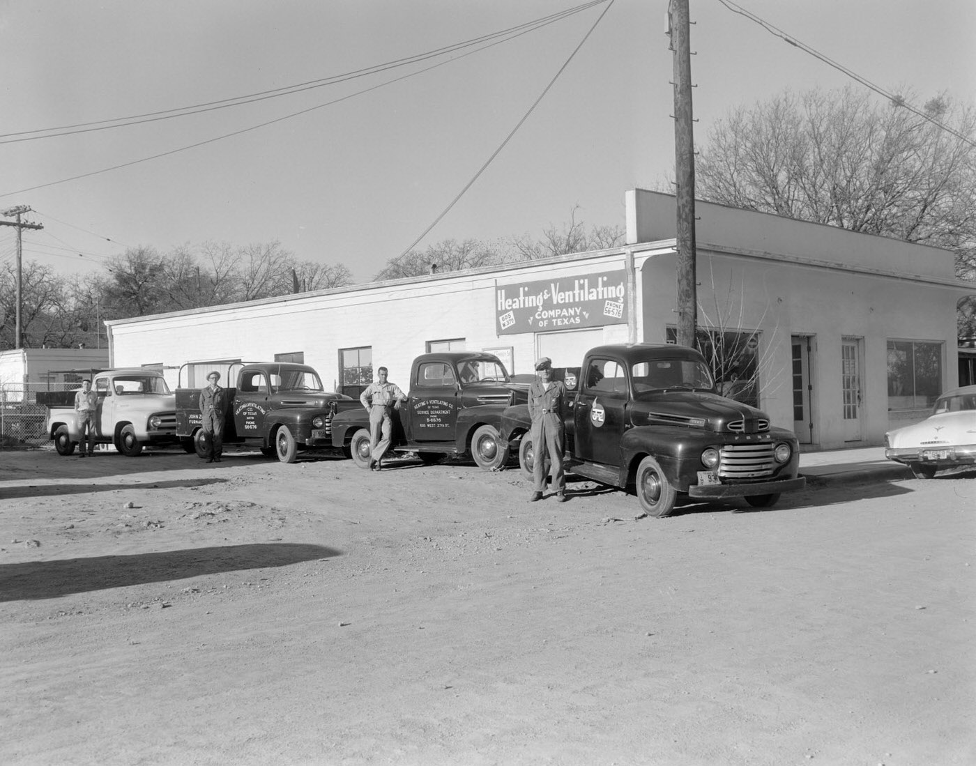 Men Next to Trucks at Texas Heating and Ventilating Company, 1954.