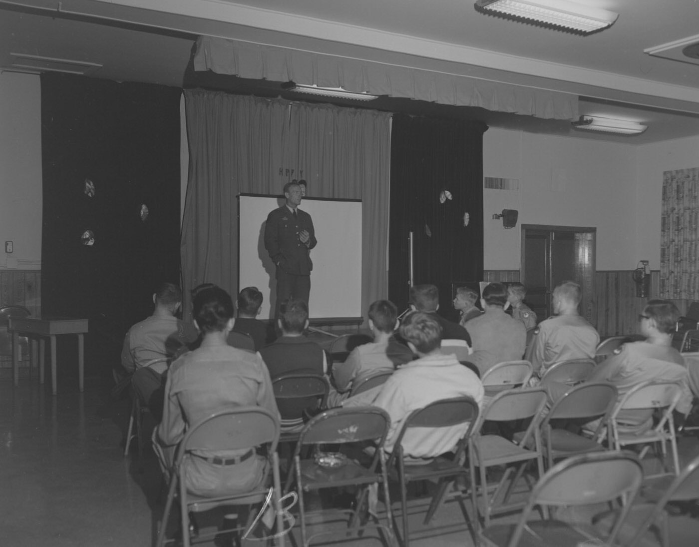 Military Presentation by Officer to Seated Soldiers, 1950s.