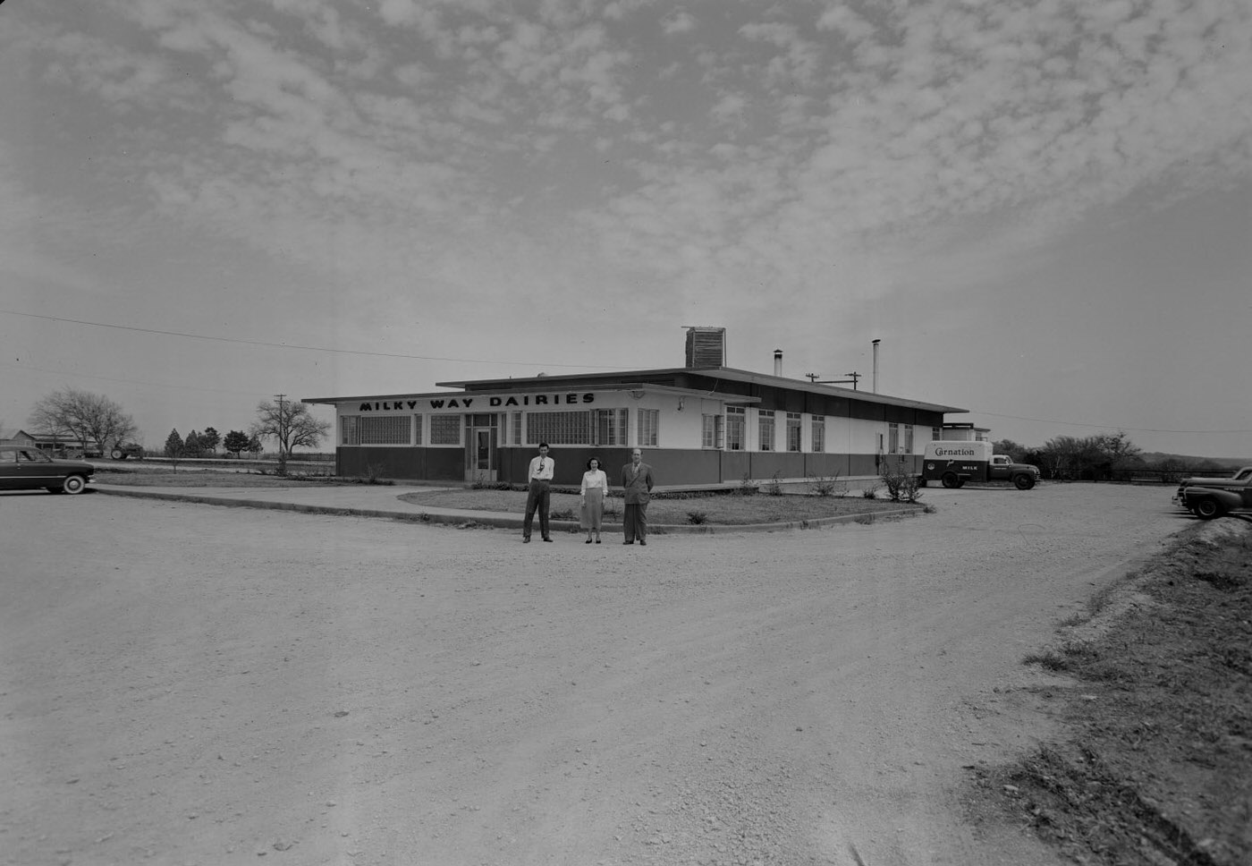 Milky Way Dairies Executives Outside Building, 1951.