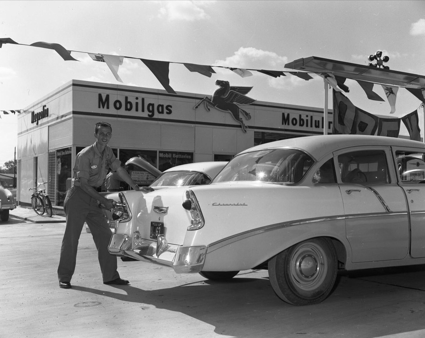 Gas Pumping at Mobil Station at Airport & Gunter, 1956.