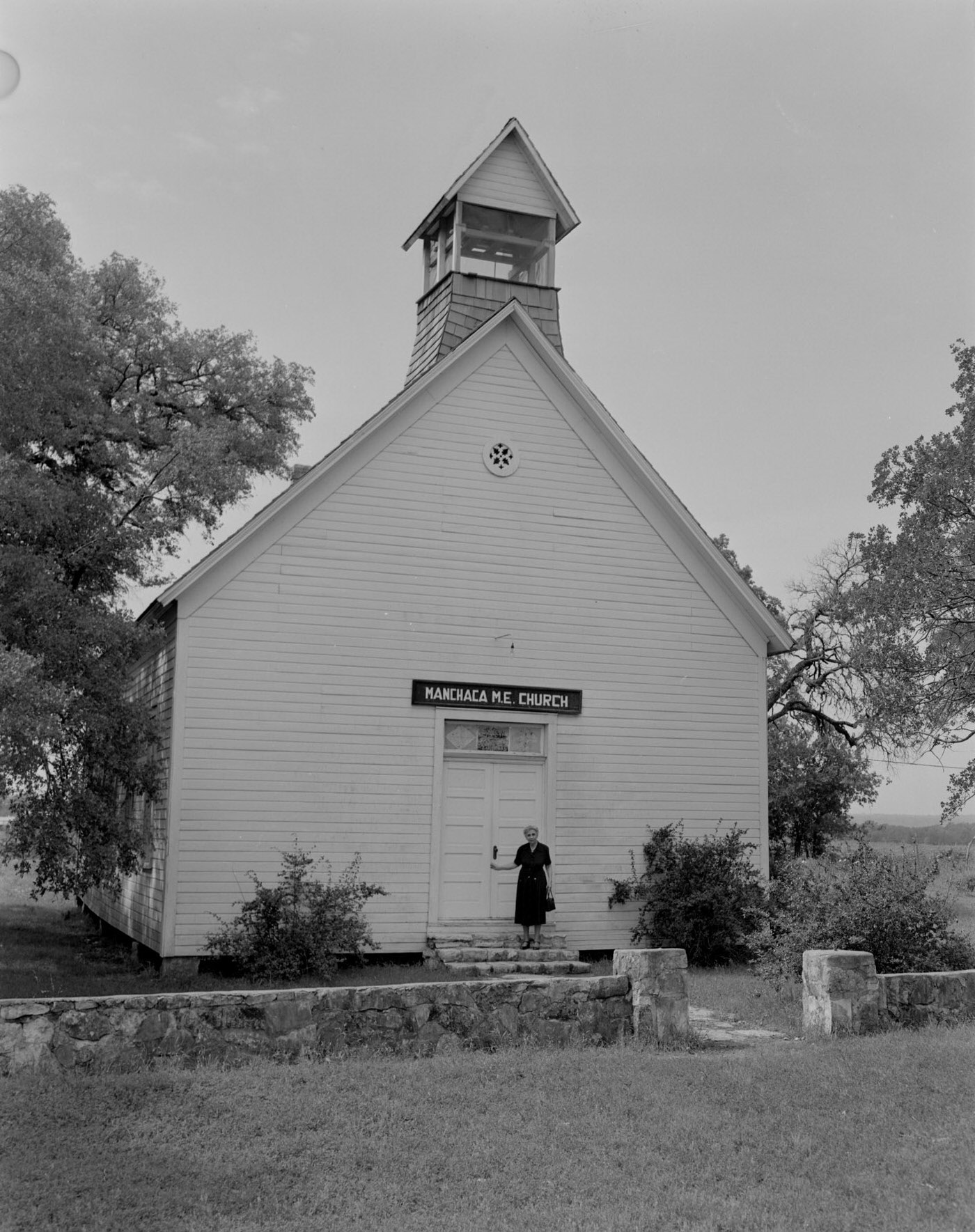 Mrs. Thomas Outside Manchaca Methodist Church, 1953.