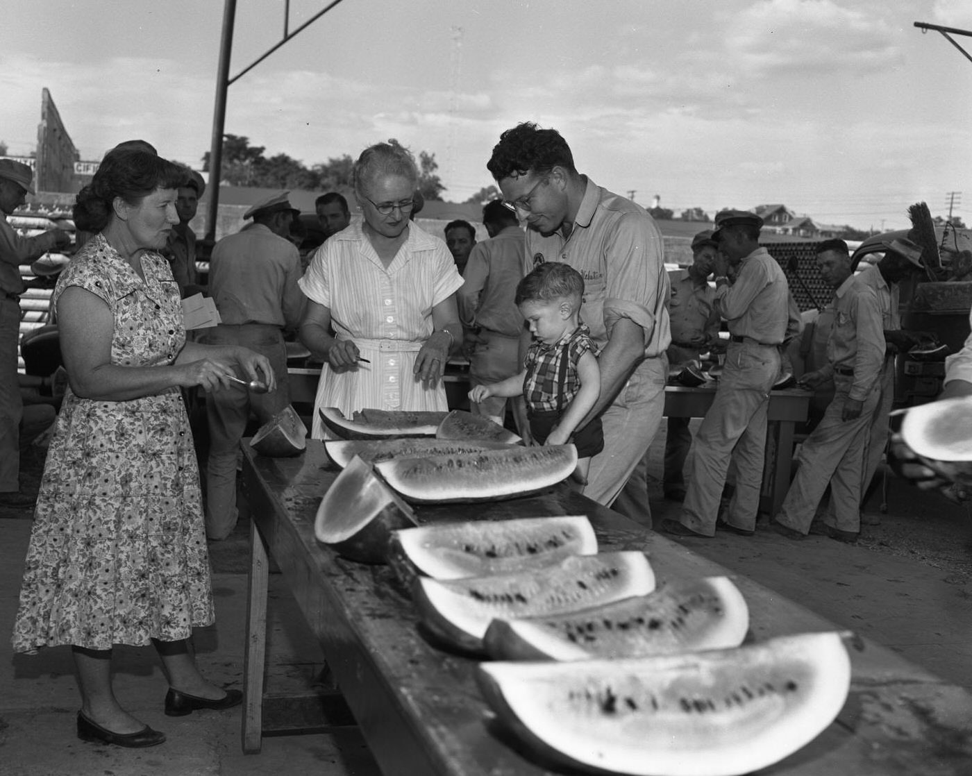 Picnic Goers Inspecting Watermelons, 1957.