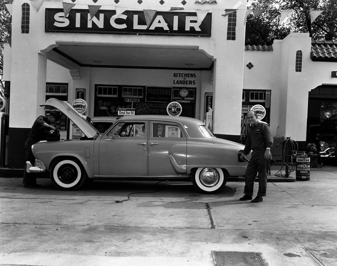 Attendants at Sinclair Service Station, 1955.
