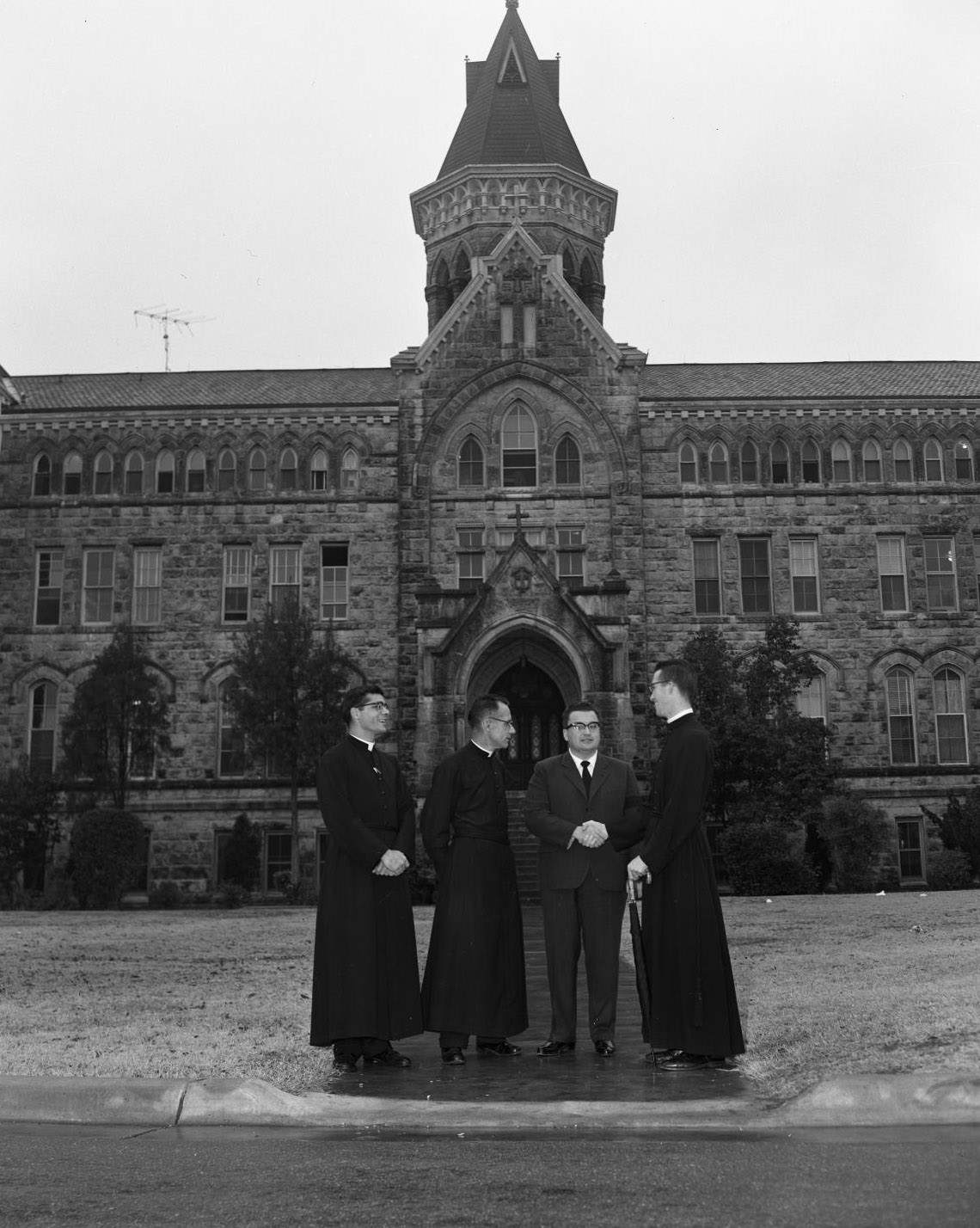 Man Discusses with Priests at US Information Agency, St. Edward's University, 1959.