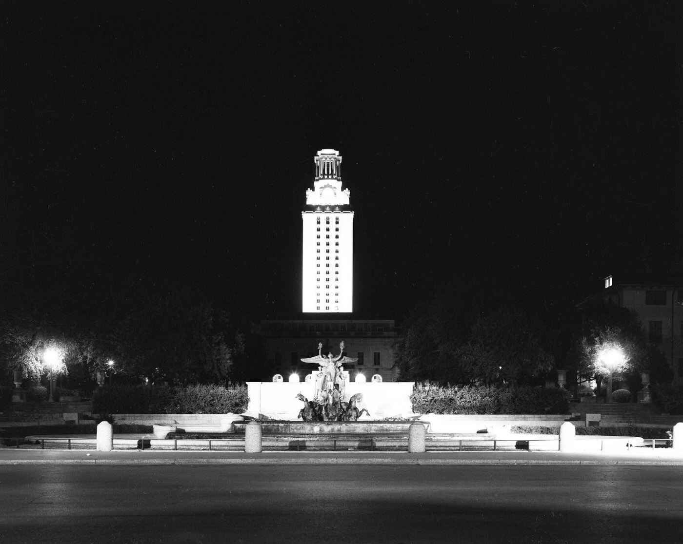 Night View of Lit UT Austin Tower on 21st Street, 1957.