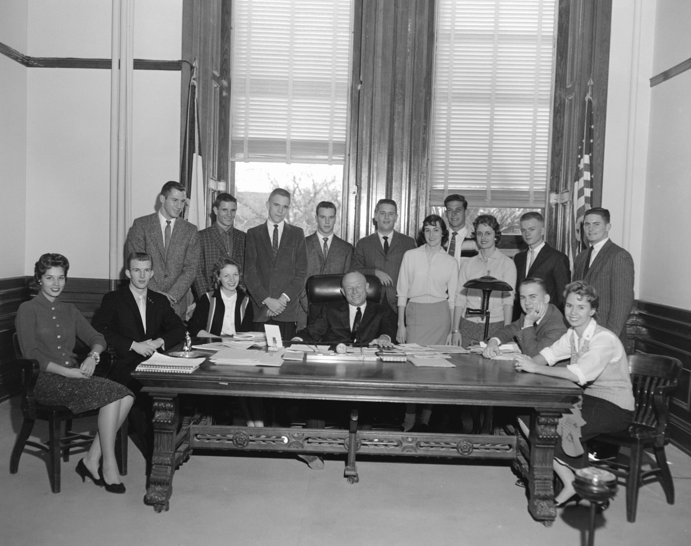Group at YMCA with Man Seated at Center, 1958.