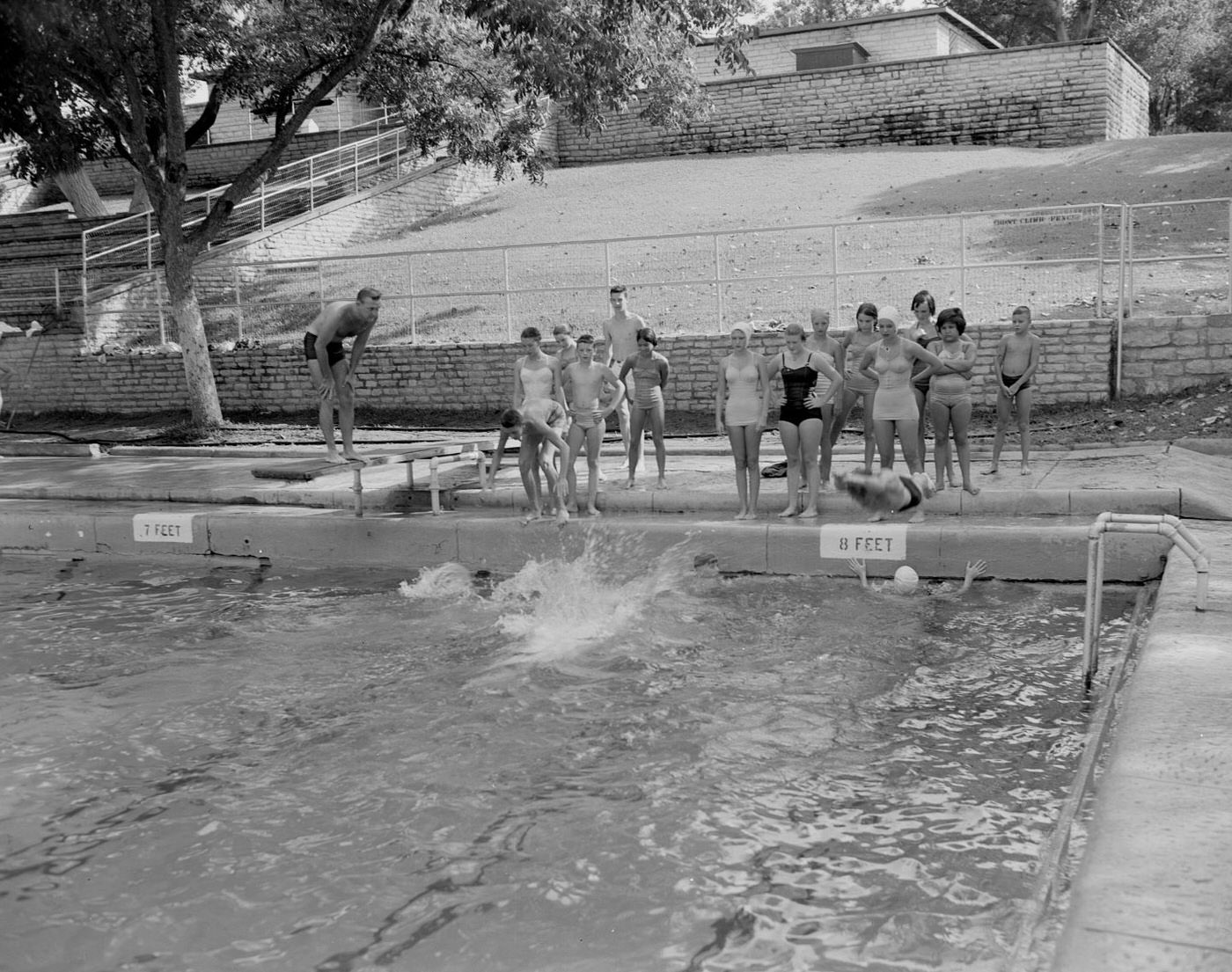 Deep Eddy Pool Scene with Boys and Girls Observing Swimmers, 1953.