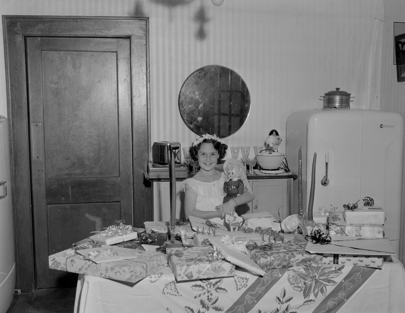 Young Girl with Doll in Front of Birthday Presents, 1951.